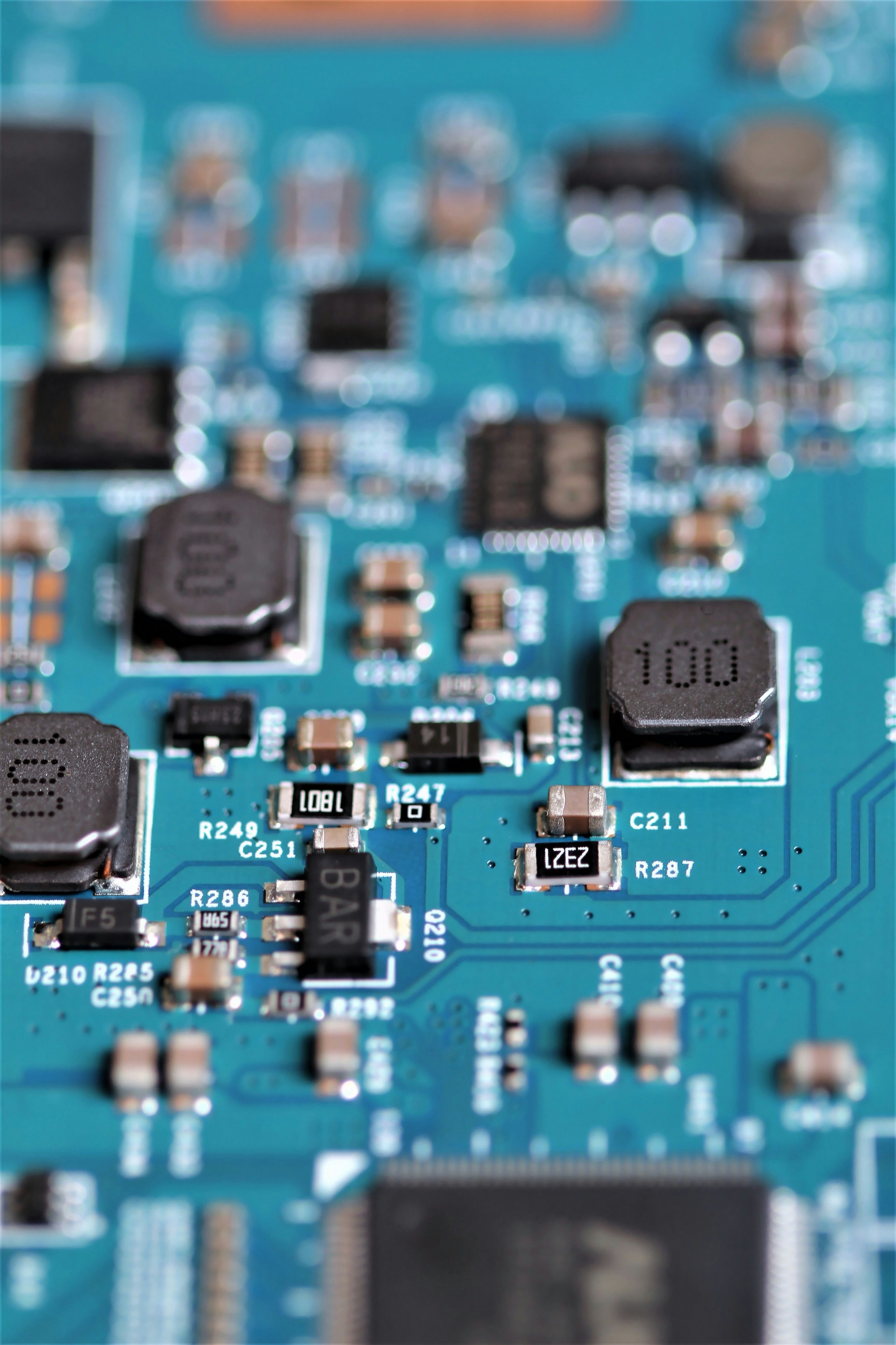 PCB testing and inspection setup with tools and assembled boards